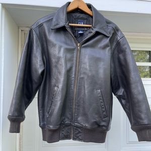 Black leather. Boys XL Gap Great cond. Sleeve length 17”. Shoulder-waist is 21”